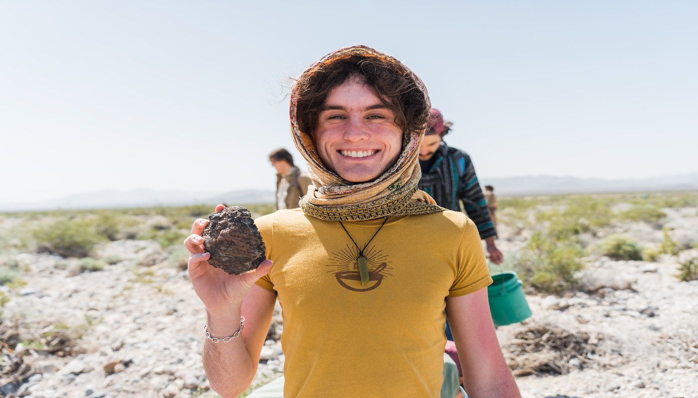 student with rock